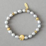 Edles Zuchtperlen Armband mit vergoldeter Muschel silbergrau gold
