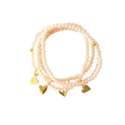Einreihiges Armband VANILLA aus Glasschliffperlen mit einem kleinem vergoldeten Herz Anhänger