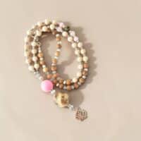MUSTER MEDIO Einzelstück Rosa Braun Bettelkette aus Olivenholz mit Lederkugel
